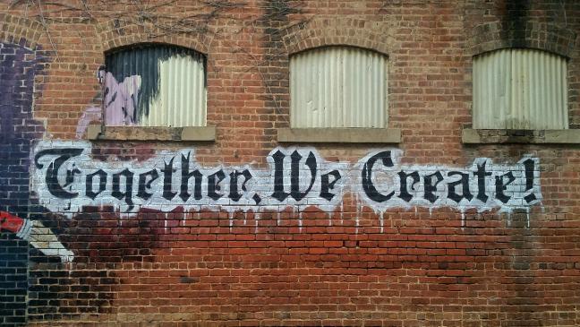 Graffiti saying Together we create